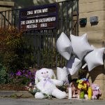 
              A teddy bear, balloons and flowers are among the items left at growing memorial at The Church in Sacramento, Calif., on Tuesday, March 1, 2022.  Authorities say a man shot and killed his three daughters, their chaperone and himself during a supervised visit with the girls at the church on Monday. (AP Photo/Rich Pedroncelli)
            