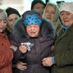 
              The mother of Russian Army soldier Rustam Zarifulin, who was killed fighting in Ukraine, center, cries surrounded by relatives during a farewell ceremony in his homeland in Kara-Balta, 60 km (37 miles) west of Bishkek, Kyrgyzstan, Sunday, March 27, 2022. (AP Photo/Vladimir Voronin)
            