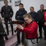 
              Ukrainian civilians receive weapons training in Lviv, Western Ukraine, Saturday, March 19, 2022. Fighting raged on multiple fronts in Ukraine more than three weeks after Russia's Feb. 24 invasion. U.N. bodies have confirmed more than 800 civilian deaths since the war began but say the real toll is considerably higher. The U.N. says more than 3.3 million people have fled Ukraine as refugees. (AP Photo/Bernat Armangue)
            