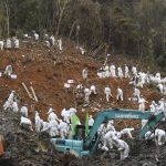
              In this photo released by Xinhua News Agency, rescuers conduct search and rescue work at the core site of Monday's plane crash in Tengxian County, southern China's Guangxi Zhuang Autonomous Region, Friday, March 25, 2022. Construction excavators dug into the crash site Saturday in the search for wreckage, remains and the second black box from a China Eastern 737-800 that nosedived into a mountainside in southern China this week with 132 people on board. (Lu Boan/Xinhua via AP)
            