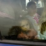 
              Children arrive in a car, at the border crossing in Medyka, Poland, Wednesday, March 2, 2022, after fleeing from the Ukraine. The U.N. refugee agency said Tuesday that around 660,000 people have fled Ukraine for neighboring countries since the Russian invasion began. (AP Photo/Markus Schreiber)
            