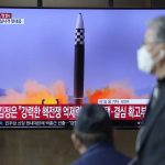 
              People watch a TV screen showing a news program reporting about North Korea's ICBM at a train station in Seoul, South Korea, Friday, March 25, 2022. North Korea said Friday it test-fired its biggest-yet intercontinental ballistic missile under the orders of leader Kim Jong Un, who vowed to expand the North's "nuclear war deterrent" while preparing for a "long-standing confrontation" with the United States. (AP Photo/Lee Jin-man)
            