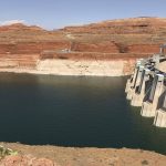 
              FILE - This Aug. 21, 2019 file photo shows Glen Canyon Dam in Page, Ariz. The elevation of Lake Powell fell below 3,525 feet (1,075 meters), a record low that surpasses a critical threshold at which officials have long warned signals their ability to general hydropower is in jeopardy. (AP Photo/Susan Montoya Bryan,File)
            