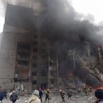 
              Firefighters work to extinguish a fire at a damaged city center after a Russian air raid in Chernigiv, Ukraine, Thursday, March 3, 2022. Russian forces have escalated their attacks on crowded cities in what Ukraine's leader called a blatant campaign of terror. (AP Photo/Dmytro Kumaka)
            