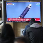 
              People watch a TV screen showing a news program reporting about North Korea's ICBM at a train station in Seoul, South Korea, Friday, March 25, 2022. North Korea said Friday it test-fired its biggest-yet intercontinental ballistic missile under the orders of leader Kim Jong Un, who vowed to expand the North's "nuclear war deterrent" while preparing for a "long-standing confrontation" with the United States. (AP Photo/Lee Jin-man)
            