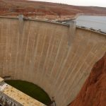 
              FILE - This September 2016 photo shows Glen Canyon Dam near Page, Ariz., which impounds Lake Powell. The elevation of Lake Powell fell below 3,525 feet (1,075 meters), a record low that surpasses a critical threshold at which officials have long warned signals their ability to general hydropower is in jeopardy. (Leah Hogsten/The Salt Lake Tribune via AP, File)
            
