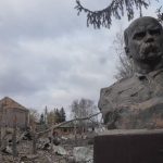 
              A bust of Taras Shevchenko, Ukrainian poet and national symbol, stands against the background of a house of culture ruined after the night air raid in the village of Byshiv, 40 kilometres west of Kyiv, Ukraine, Friday, March 4, 2022. (AP Photo/Efrem Lukatsky)
            