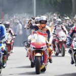 
              Spain riders Joan Mir, left, Pol Espargaro, center, and Jorge Martin, right, participate in a parade in Jakarta, Indonesia Wednesday, March 16, 2022. Indonesia will hold the Moto GP at Mandalika, Lombok Island on March 18-20. (AP Photo/Achmad Ibrahim)
            