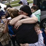 
              Ukrainian Irina Oscaria, 21 years, resident in Spain, hugs her mother Zhana Onishchenko after they arrived in Cizur Menor, northern Spain, Tuesday, March 15, 2022, after Russian's invasion of Ukraine. Oscaria's family traveled more than five thousands kilometers to arrive in Spain. (AP Photo/Alvaro Barrientos)
            