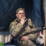 
              Ukrainian serviceman has a rest on his position in Kharkiv, Ukraine, Tuesday, March 22, 2022. (AP Photo/Andrew Marienko)
            