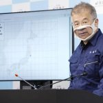 
              A worker of meteorological bureau speaks during a press conference in Tokyo Thursday, March 17, 2022, following an earthquake. A powerful earthquake struck off the coast of Fukushima in northern Japan on Wednesday evening, triggering a tsunami advisory and plunging more than 2 million homes in the Tokyo area into darkness.  (Kyodo News via AP)
            
