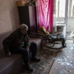 
              Volodymyr, 80, rests inside his apartment damaged by shelling, in Kyiv, Ukraine,Wednesday, March 23, 2022. (AP Photo/Rodrigo Abd)
            