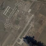 
              In this satellite picture from Planet Labs PBC, fire and smoke is seen at Kherson International Airport and Air Base in Kherson, Ukraine, Tuesday, March 15, 2022. A suspected Ukrainian strike on the air base damaged Russian helicopters and vehicles Tuesday. (Planet Labs PBC via AP)
            