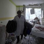 
              A medical worker walks inside of the damaged by shelling maternity hospital in Mariupol, Ukraine, Wednesday, March 9, 2022. A Russian attack has severely damaged a maternity hospital in the besieged port city of Mariupol, Ukrainian officials say. (AP Photo/Evgeniy Maloletka)
            