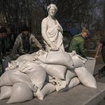
              Municipal workers cover the statue of Italian poet and philosopher Dante Alighieri with sandbags to protect it from potential damage from shelling, in Kyiv, Ukraine, Wednesday, March 23, 2022. The statue, by sculptor Luciano Massari, was inaugurated in 2015 to mark 750 years since Dante's birth. (AP Photo/Vadim Ghirda)
            
