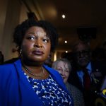 
              Georgia gubernatorial Democratic candidate Stacey Abrams talks to the media after qualifying for the 2022 election on Tuesday, March 8, 2022, in Atlanta. Abrams has no announced opposition for governor for the Democratic nomination. (AP Photo/Brynn Anderson)
            