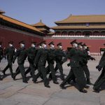 
              Chinese soldiers march past the Forbidden City on Friday, March 4, 2022, in Beijing. As China's 3,000-member ceremonial parliament prepare to open its annual session Saturday, March 5, 20222, China's defense budget, largely oriented toward possible military action in Taiwan, is another marquee item that is scrutinized closely by Congress watchers. (AP Photo/Ng Han Guan)
            