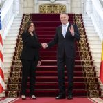 
              Romanian President Klaus Iohannis shakes hands with US Vice President Kamala Harris as she arrives for meetings at Cotroceni Palace in Otopeni, Romania, Friday, March 11, 2022. (Saul Loeb/Pool Photo via AP)
            