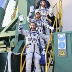 
              In this handout photo released by Roscosmos Space Agency, Russian cosmonauts, commander Оleg Аrtemyiev flight engineers Denis Мatveev and Sergei Korsakov, members of the main crew to the International Space Station (ISS), wave near the rocket prior the launch at the Baikonur Cosmodrome, Kazakhstan, Friday, March 18, 2022. (Roscosmos Space Agency via AP)
            