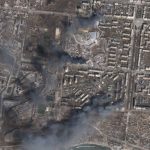 
              In this satellite photo from Planet Labs PBC, multiple civilian buildings burn amid Russian strikes on the Livoberezhnyi District of Mariupol, Ukraine, Sunday, March 20, 2022. Ukrainian authorities said Sunday that Russia's military bombed an art school sheltering some 400 people in the port city of Mariupol, where heavy street fighting was underway weeks into a devastating Russian siege. (Planet Labs PBC via AP)
            