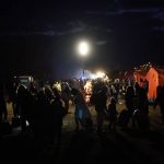 
              Refugees fleeing war in neighboring Ukraine gather at the Medyka border crossing, Poland, Thursday, March 10, 2022. (AP Photo/Daniel Cole)
            