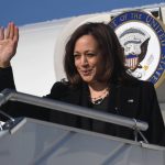
              US Vice President Kamala Harris waves as she boards the Air Force Two prior to departing for Romania, at Warsaw Chopin International Airport, in Warsaw, Poland, Friday, March 11, 2022. (Saul Loeb/Pool Photo via AP)
            