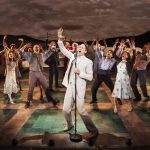 
              Todd Almond performs with the cast in "Girl From the North Country" in New York. The Depression-era drama set to the songs of Bob Dylan, will re-open on Broadway this spring, a little more than three months after going on hiatus due to virus concerns. (Matthew Murphy/Rubenstein via AP)
            