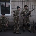 
              Civilian volunteers attend a training camp of the Ukrainian Territorial Defense Forces in Brovary, northeast of Kyiv, Ukraine, Monday, March 21, 2022. (AP Photo/Felipe Dana)
            