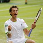 
              FILE -Sergiy Stakhovsky of Ukraine reacts as he wins against Roger Federer of Switzerland in their men's second round singles match at the All England Lawn Tennis Championships in Wimbledon, London, Wednesday, June 26, 2013. About 1 1/2 months after the last match of Sergiy Stakhovsky’s professional tennis career, the 36-year-old Ukrainian left his wife and three young children in Hungary and went back to his birthplace to help however he could during Russia’s invasion. (AP Photo/Anja Niedringhaus, File)
            