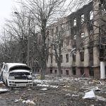 
              Damaged cars and a destroyed accommodation building are seen near a checkpoint in Brovary, outside Kyiv, Ukraine, Tuesday, March 1, 2022. Russian shelling pounded civilian targets in Ukraine's second-largest city Tuesday and a 40-mile convoy of tanks and other vehicles threatened the capital — tactics Ukraine's embattled president said were designed to force him into concessions in Europe's largest ground war in generations. (AP Photo/Efrem Lukatsky)
            