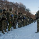 
              Ukrainian servicemen attend a training session outside Kharkiv, Ukraine, Friday, March 11, 2022. (AP Photo/Andrew Marienko)
            