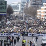 
              Many thousands of demonstrators walk down Willy-Brandt-Strasse, a main thoroughfare in Hamburg, Germany, carrying banners reading ""No more war"." and ""Another world is possible"." on Thursday, March 3, 2022. The Fridays for Future organization is taking to the streets around the world this Thursday to express solidarity with Ukraine and to protest Russia's attack on the country. (Daniel Reinhardt/dpa via AP)
            
