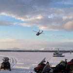 
              In this photo provided by Alaska State Troopers, snowmobiles and a plane that responded to provide assistance are seen gathered on a frozen lake in southwest Alaska that was the site of a small plane crash on Saturday, March 5, 2022, near Iliamna, Alaska. Authorities say the five people on board the plane were injured.  (Trooper Travis Lons/Alaska State Troopers via AP)
            