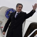 
              US Secretary of State Antony Blinken waves as he boards a military aircraft prior to his departure from Chisinau, Moldova, Sunday, March 6, 2022. Blinken travels to Poland, Moldova, Latvia, Lithuania, and Estonia to reassure them of US support amid Russia's invasion of Ukraine. (Olivier Douliery, Pool via AP)
            