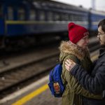 
              A couple says good-bye before she boards on a train bound for Lviv at the Kyiv station, Ukraine, Thursday, March 3. 2022. Ukrainian men have to stay to fight in the war while women and children are leaving the country to seek refuge in a neighboring country. (AP Photo/Emilio Morenatti)
            