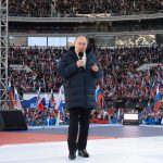 
              Russian President Vladimir Putin delivers his speech at the concert marking the eighth anniversary of the referendum on the state status of Crimea and Sevastopol and its reunification with Russia, in Moscow, Russia, Friday, March 18, 2022. (Ramil Sitdikov/Sputnik Pool Photo via AP)
            