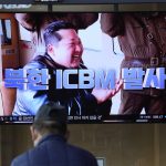 
              A man watches a TV screen showing a news program reporting about North Korea's ICBM with an image of North Korean leader Kim Jong Un at a train station in Seoul, South Korea, Friday, March 25, 2022. North Korea said Friday it test-fired its biggest-yet intercontinental ballistic missile under the orders of leader Kim Jong Un, who vowed to expand the North's "nuclear war deterrent" while preparing for a "long-standing confrontation" with the United States. The letters read "North Korea, Fire ICBM." (AP Photo/Lee Jin-man)
            