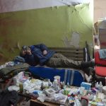 
              A local citizen rests in a basement for shelter in the center of the town of Irpin, some 25 km (16 miles) northwest of Kyiv, Friday, March 11, 2022. Kyiv northwest suburbs such as Irpin and Bucha have been enduring Russian shellfire and bombardments for over a week prompting residents to leave their home. (AP Photo/Efrem Lukatsky)
            