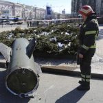 
              A firefighter looks at a fragment of a Ukrainian Tochka-U missile on a street in Donetsk in eastern Ukraine, Monday, March 14, 2022. The Russian military says that 20 civilians have been killed by a ballistic missile launched by the Ukrainian forces. Russian Defense Ministry spokesman Maj. Gen. Igor Konashenkov said that the Soviet-made Tochka-U missile on Monday hit the central part of the eastern city of Donetsk, the center of the separatist Donetsk region. (AP Photo/Alexei Alexandrov)
            