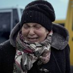 
              A woman who was evacuated from Irpin, cries after arriving at a triage point in Kyiv, Ukraine, Wednesday, March 9, 2022. A Russian airstrike devastated a maternity hospital Wednesday in the besieged port city of Mariupol amid growing warnings from the West that Moscow's invasion is about to take a more brutal and indiscriminate turn. (AP Photo/Vadim Ghirda)
            