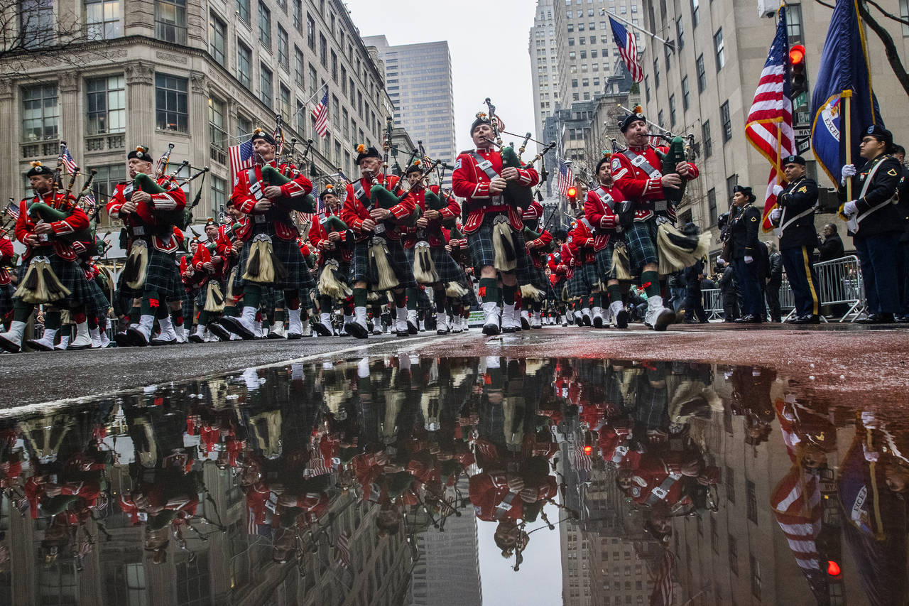 Bagpipers march up Fifth Avenue while they pass in front of St. Patrick Cathedral during the St. Pa...