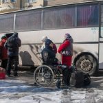 
              Refugees board a bus to leave Kharkiv, Ukraine, Saturday, March 12, 2022. (AP Photo/Andrew Marienko)
            