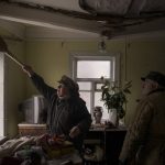 
              Galina helps clean the house of a neighbour that was damaged by a Russian bombing in Baryshivka, east of Kyiv, Ukraine, Friday, March 11, 2022. (AP Photo/Felipe Dana)
            