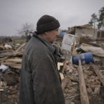 
              A man stands in the ruins of a house, destroyed during fighting between Russian and Ukrainian forces in the village of Yasnohorodka, on the outskirts of Kyiv, Ukraine, Wednesday, March 30, 2022. Russian forces bombarded areas around Kyiv and another city, just hours after pledging to scale back military operations in those places to help negotiations along, Ukrainian authorities said Wednesday. (AP Photo/Vadim Ghirda)
            