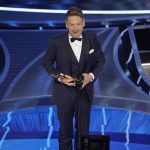 
              Kenneth Branagh accepts the award for best original screenplay for "Belfast" at the Oscars on Sunday, March 27, 2022, at the Dolby Theatre in Los Angeles. (AP Photo/Chris Pizzello)
            