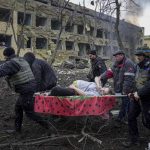 
              Ukrainian emergency employees and volunteers carry an injured pregnant woman from the damaged by shelling maternity hospital in Mariupol, Ukraine, Wednesday, March 9, 2022. A Russian attack has severely damaged a maternity hospital in the besieged port city of Mariupol, Ukrainian officials say. (AP Photo/Evgeniy Maloletka)
            