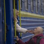 
              A woman bids a man goodbye after boarding a Lviv bound train, in Kyiv, Ukraine, Thursday, March 3, 2022. Ukrainian President Volodymyr Zelenskyy's office says a second round of talks with Russia aimed at stopping the fighting that has sent more than 1 million people fleeing over Ukraine's borders, has begun in neighboring Belarus, but the two sides appeared to have little common ground. (AP Photo/Vadim Ghirda)
            