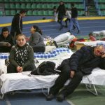 
              Refugees from Ukraine rest at a facility for refugees in Chisinau, Moldova, Saturday, March 5, 2022. (AP Photo/Aurel Obreja)
            