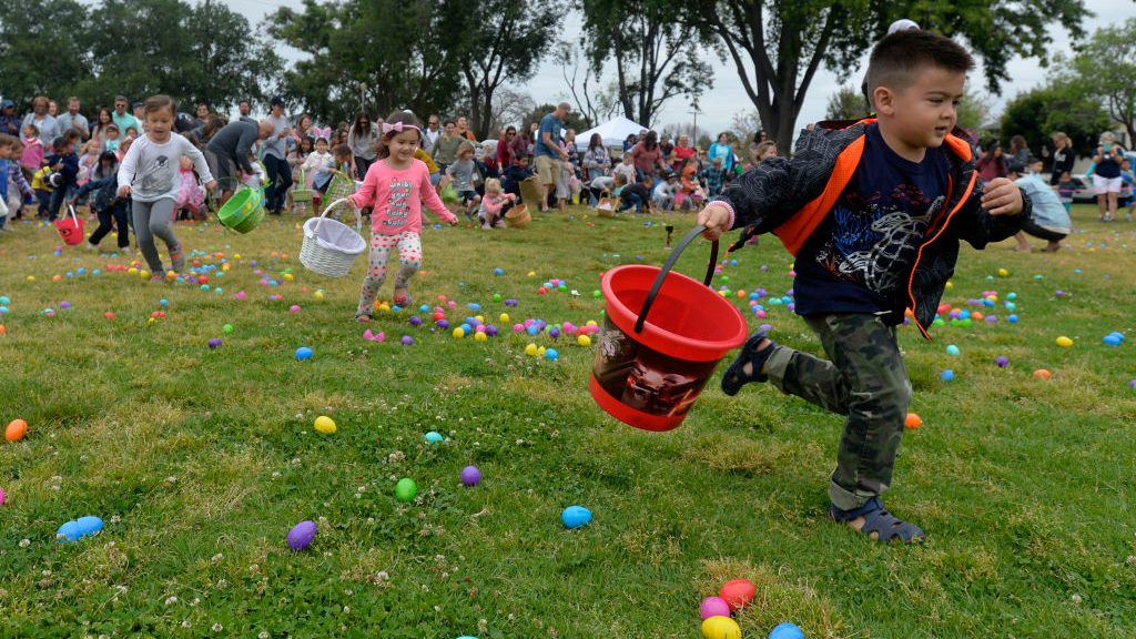 The second round of kids take off running for the promise of candy during the community egg hunt pr...