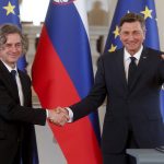 
              Robert Golob, left, the leader of the Freedom Movement party shakes hands with President Borut Pahor, in Ljubljana, Slovenia, Tuesday, April 26, 2022. The winner of last weekend's parliamentary election in Slovenia said after the meeting that he hopes to have a new government formed by mid-June. (AP Photo)
            